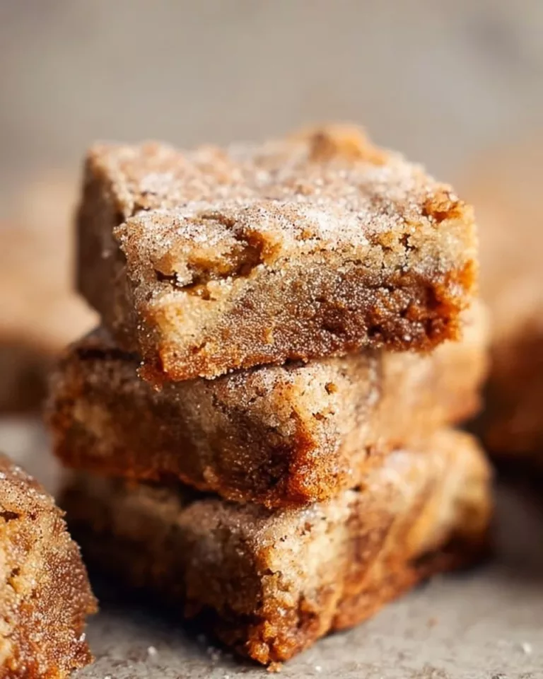Delicious Cinnamon Sugar Blondies topped with a sprinkle of cinnamon sugar