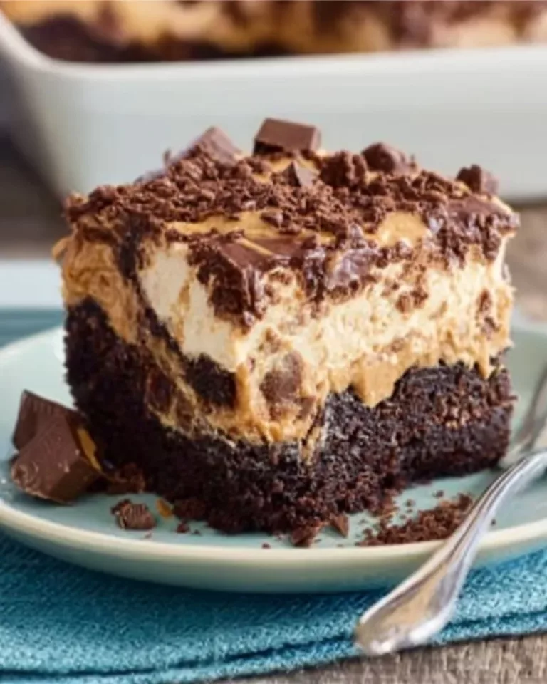 Delicious Reese's Poke Cake topped with chocolate and peanut butter frosting