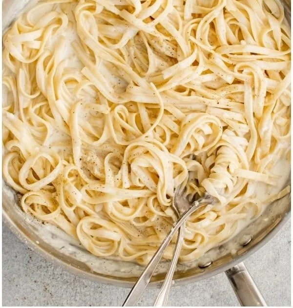 Bowls of creamy Alfredo Sauce ready to enhance your pasta dishes