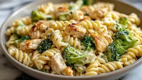 Creamy rotisserie chicken pasta with broccoli served in a bowl