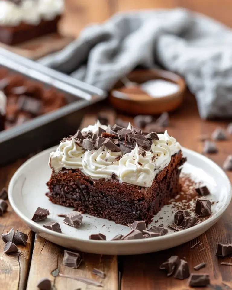 Moist chocolate sheet cake with whipped cream and chocolate ganache topping